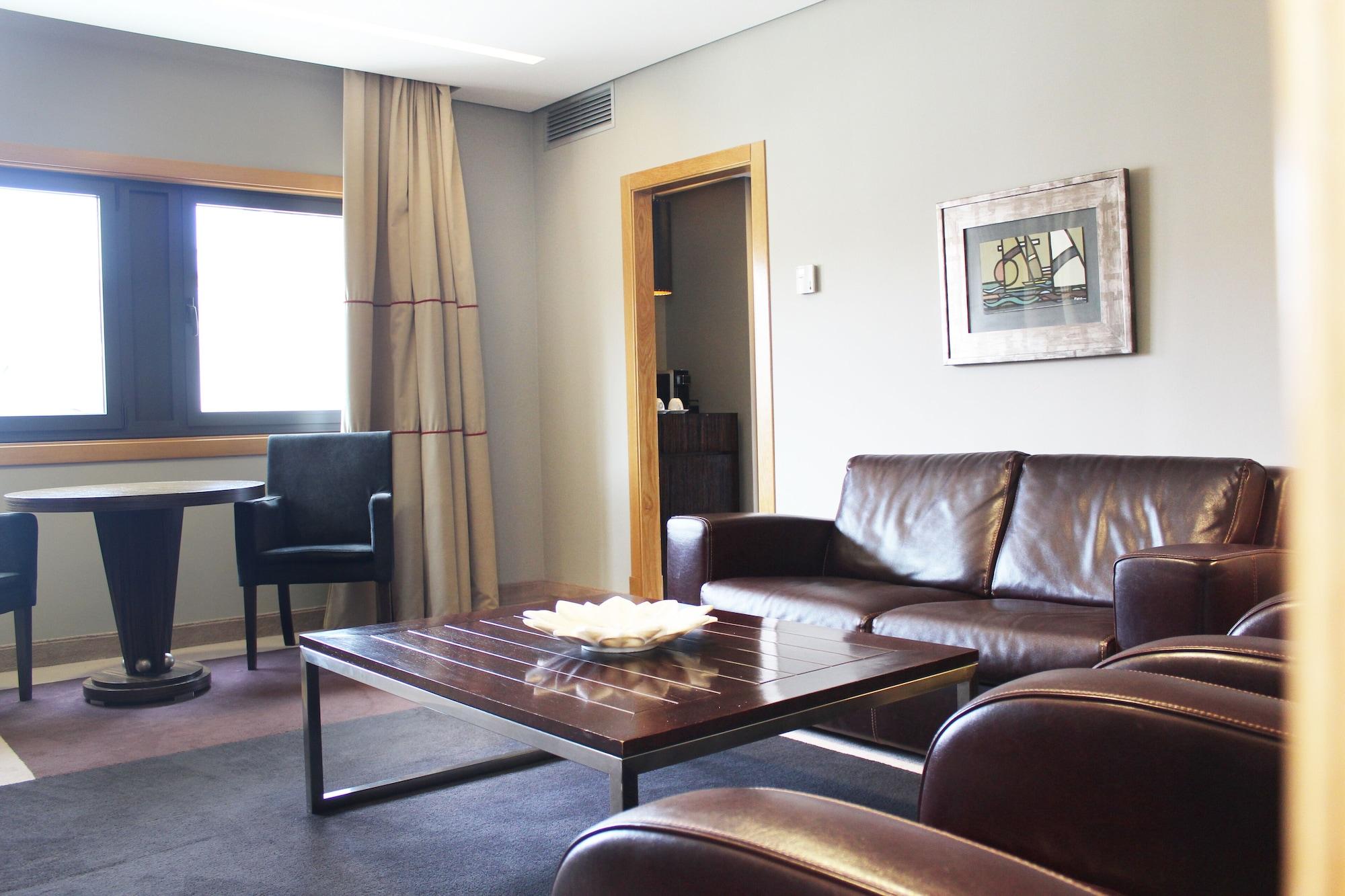 Pazo Los Escudos Hotel Spa & Resort Vigo Exterior photo A living room in a hotel suite